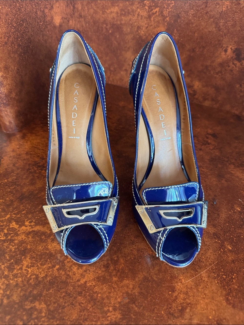 Casadei Blue Patent Peep-Toe Pumps with Silver Buckle Detail